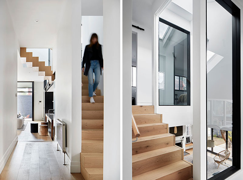 In this renovated home, the wood stairs that connect the various levels of the house can be seen from the hallway and living areas. #Stairs