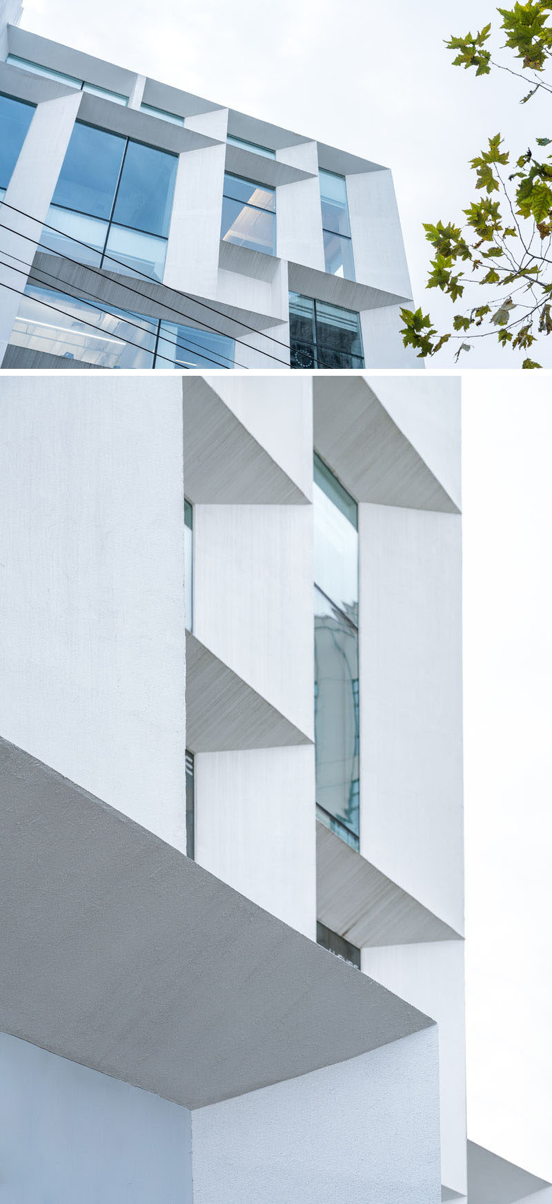 The simple white exterior of this modern office building features angled frames, and is like a beacon of light for the surrounding neighborhood. #ModernOfficeBuilding #Architecture