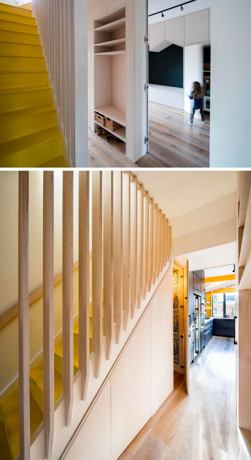 In this updated house by Woodrow Architects, a hallway runs between the playroom and the stairs, creating space for open shelving, while underneath the yellow stairs, there's a small powder room. #YellowStairs #Hallway #OpenShelving Visit Woodrow Architect's website here > https://www.wdrw.co.uk