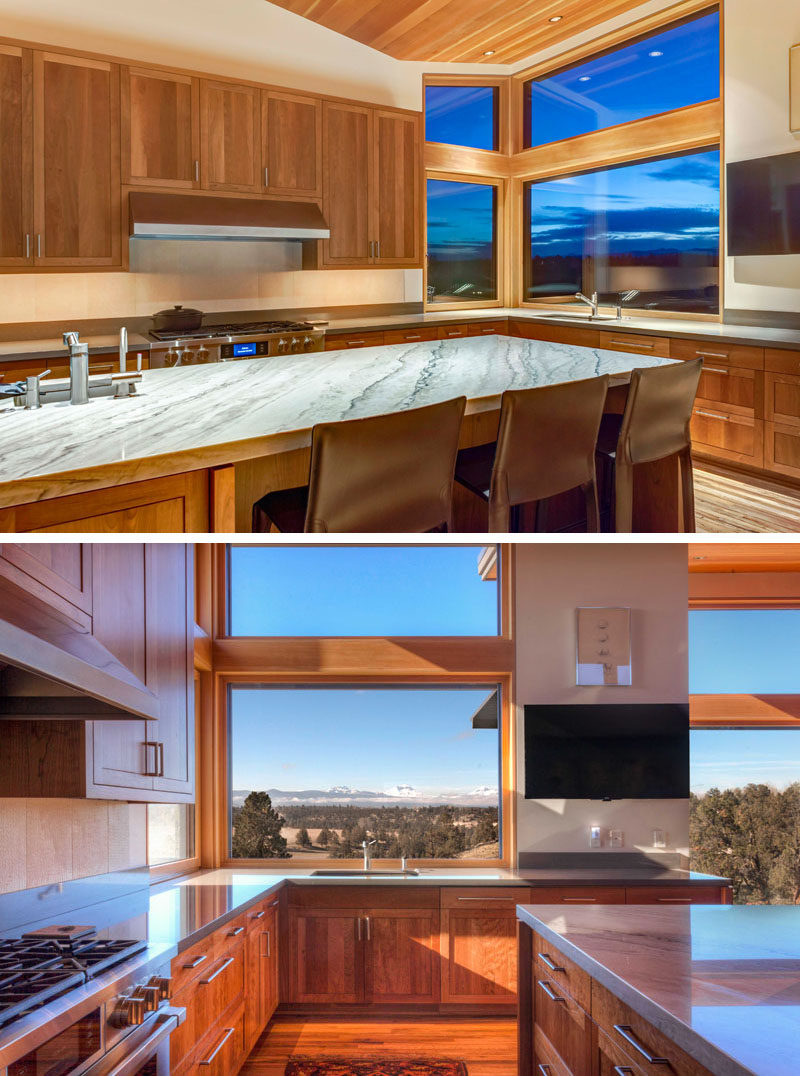 This contemporary kitchen with wood cabinets visually connects to the living room, and a large island provides plenty of counter space for cooking and entertaining. #WoodKitchen #ContemporaryKitchen #KitchenDesign