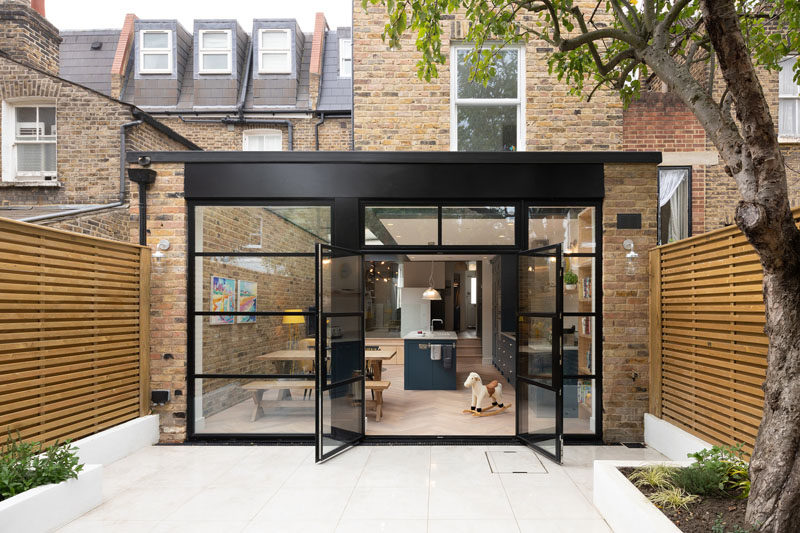 British firm Sketch Architects, have completed the refurbished a terraced home in South West London by adding a spacious, bright rear extension, that features a large glass door extending into the garden, and a usable, playful basement room. #ModernHouseExtension #Extension #Architecture