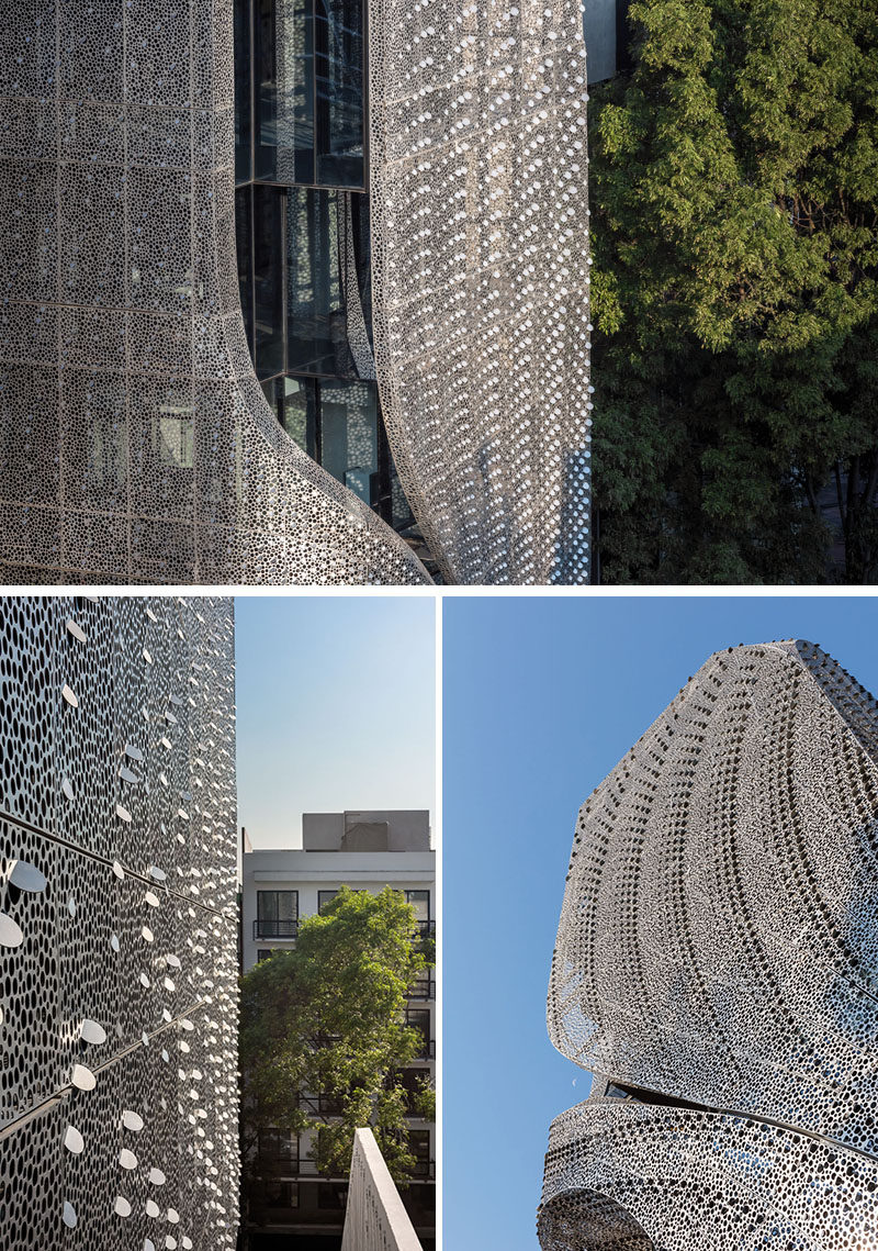 This modern office building in Mexico City, Mexico, has a perforated carbon-steel screen facade that follows the shape of the building, and has a delicate pattern that provides interior shadows and ventilation. #ModernArchitecture #ModernBuilding #BuildingFacade