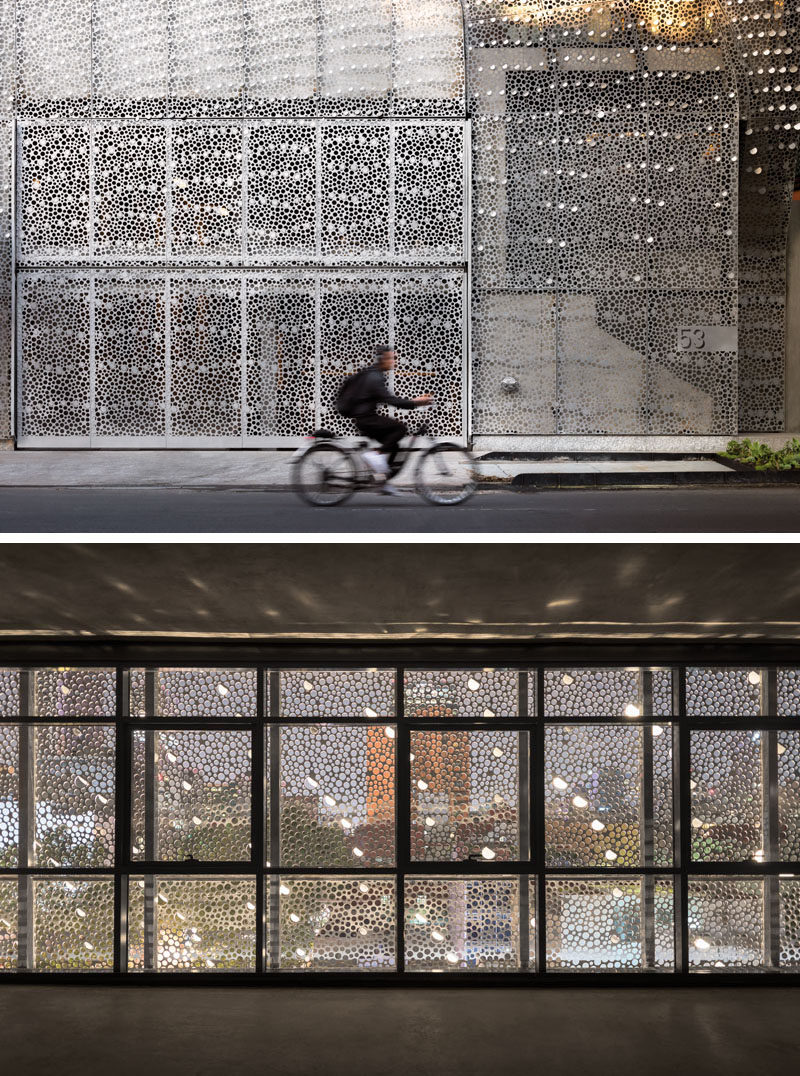 This modern office building in Mexico City, Mexico, has a perforated carbon-steel screen facade that follows the shape of the building, and has a delicate pattern that provides interior shadows and ventilation. #ModernArchitecture #ModernBuilding #BuildingFacade