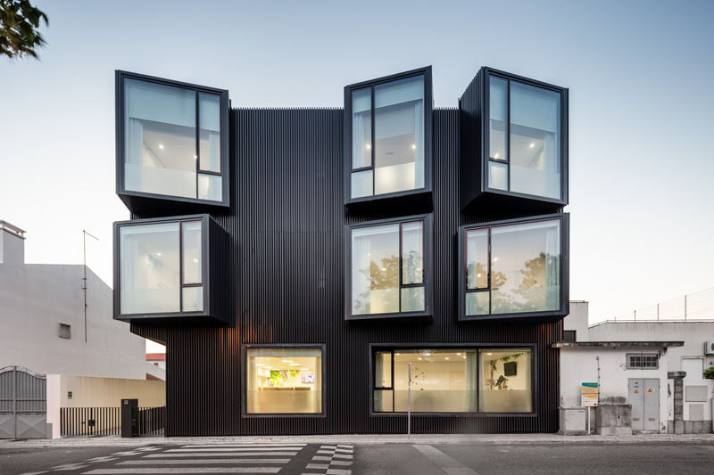 Architecture firm Nuno Piedade Alexandre has designed a elderly care home that features a black slat facade with protruding angled windows. #Architecture #Windows #BlackBuilding #BuildingDesign