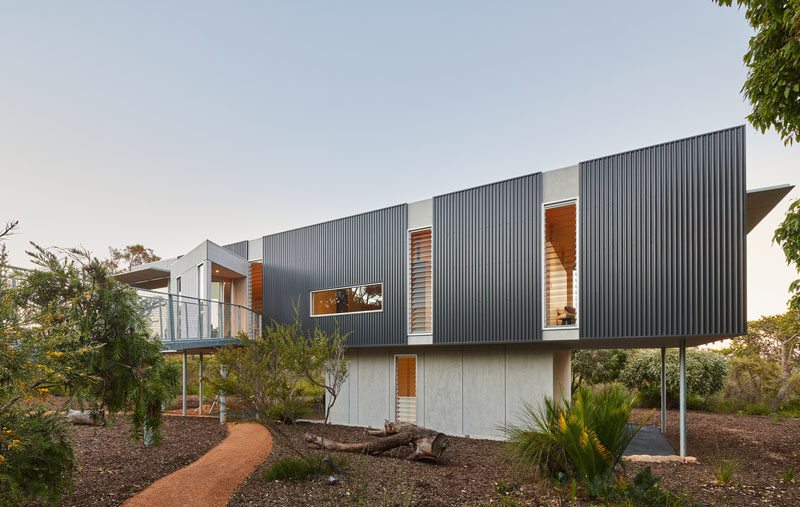 Architectural firm Archterra, has designed the Wilderness House, a partially elevated home in Margaret River, Australia, that's surrounded by a variety of native trees. #ModernHouse #ModernArchitecture