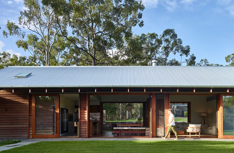 All of the social areas of this house have large sliding wood-framed glass doors, creating an indoor/outdoor living environment. #SlidingDoors #ModernArchitecture