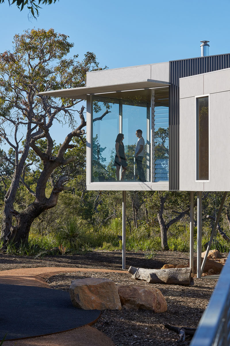 This modern house has narrow, louvered ventilation slots that work in tandem with the sliding doors to quickly exhaust any build up of hot air during the summer months. #LouveredWindows #WindowDesign