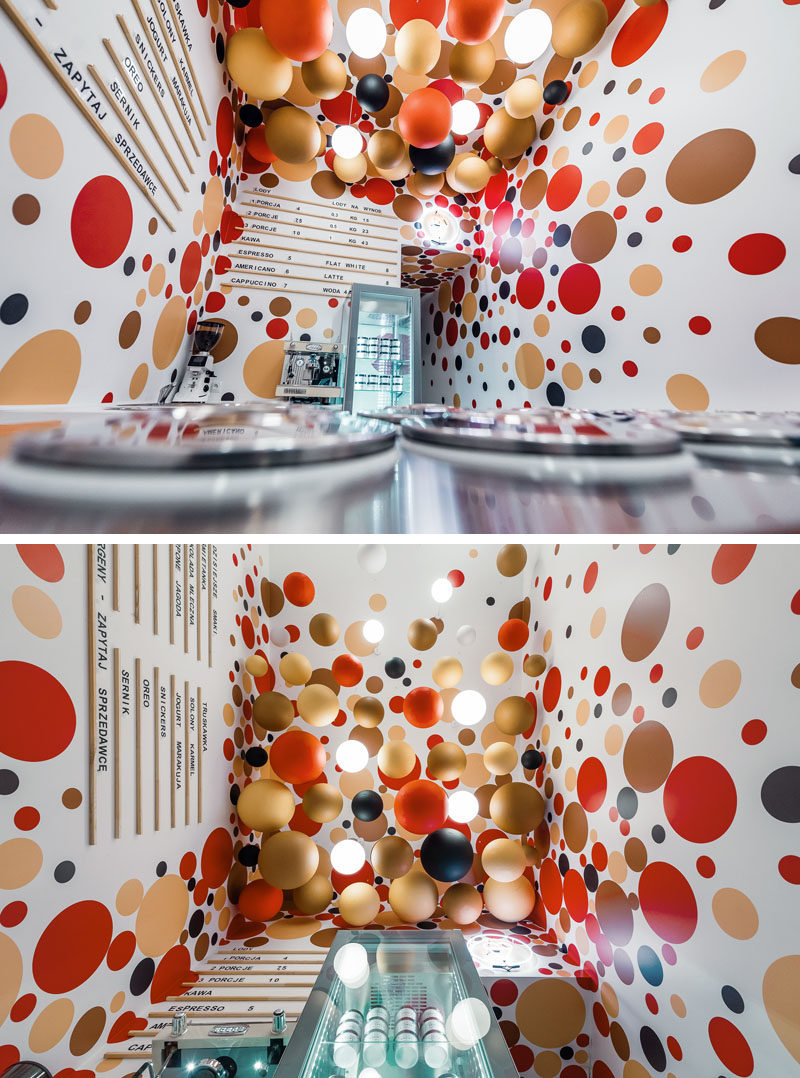 This modern ice-cream shop features colorful suspended balls and lighting from the ceilings, and dots on the walls complement the ball installation on the ceiling. #IceCreamShop #RetailDesign #InteriorDesign
