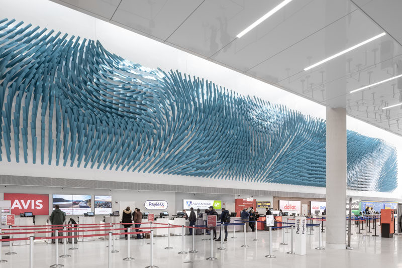 Artist Rob Ley has created 'Field Lines', a large art installation at O’Hare Airport Transit Hub in Chicago, Illinois, that's designed to evoke the flow of a steady breeze in a field. #Art #Sculpture #Design