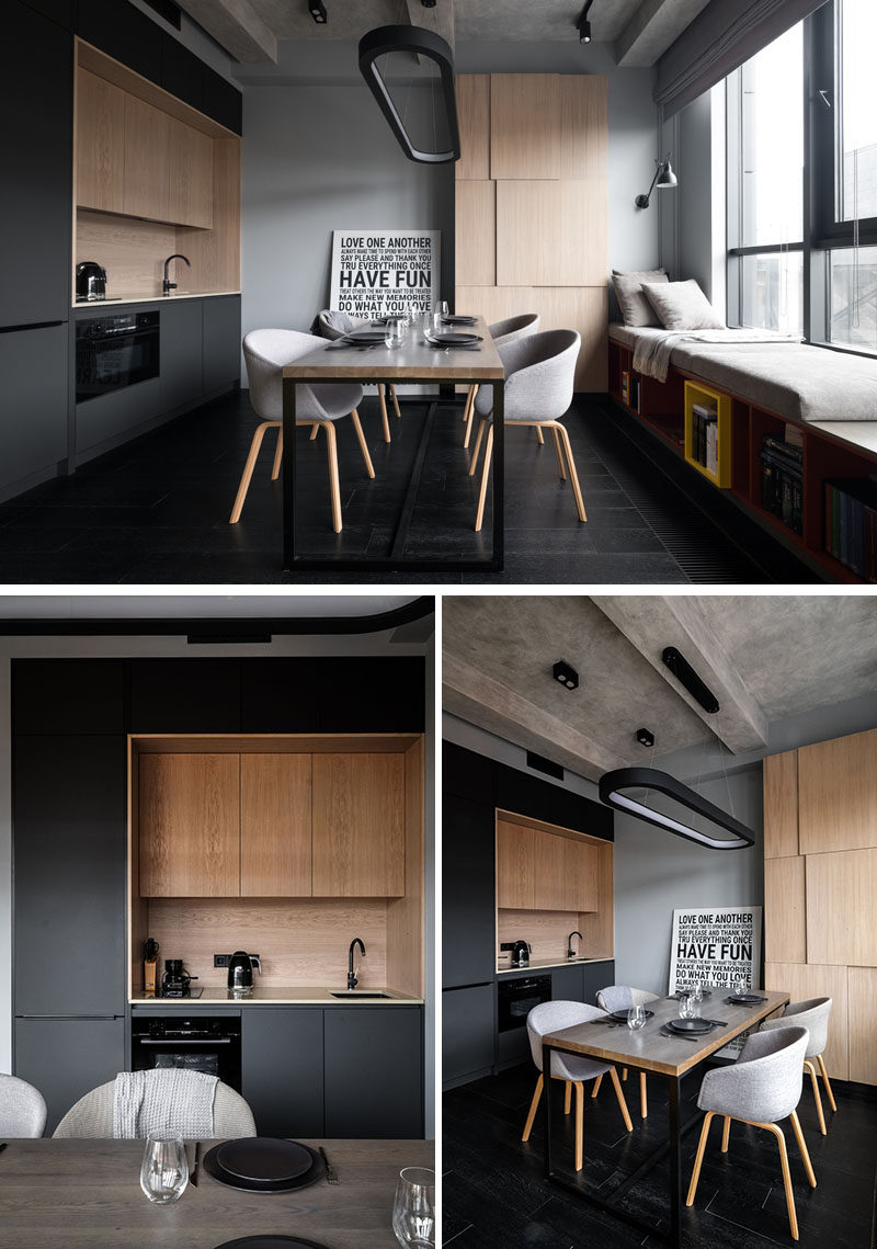 In this small and modern apartment, a minimal matte black kitchen with wood accents was added to the wall, while a dining table provides additional food prep space and a place to dine. #BlackKitchen #DiningRoom #ModernApartment #SmallKitchen