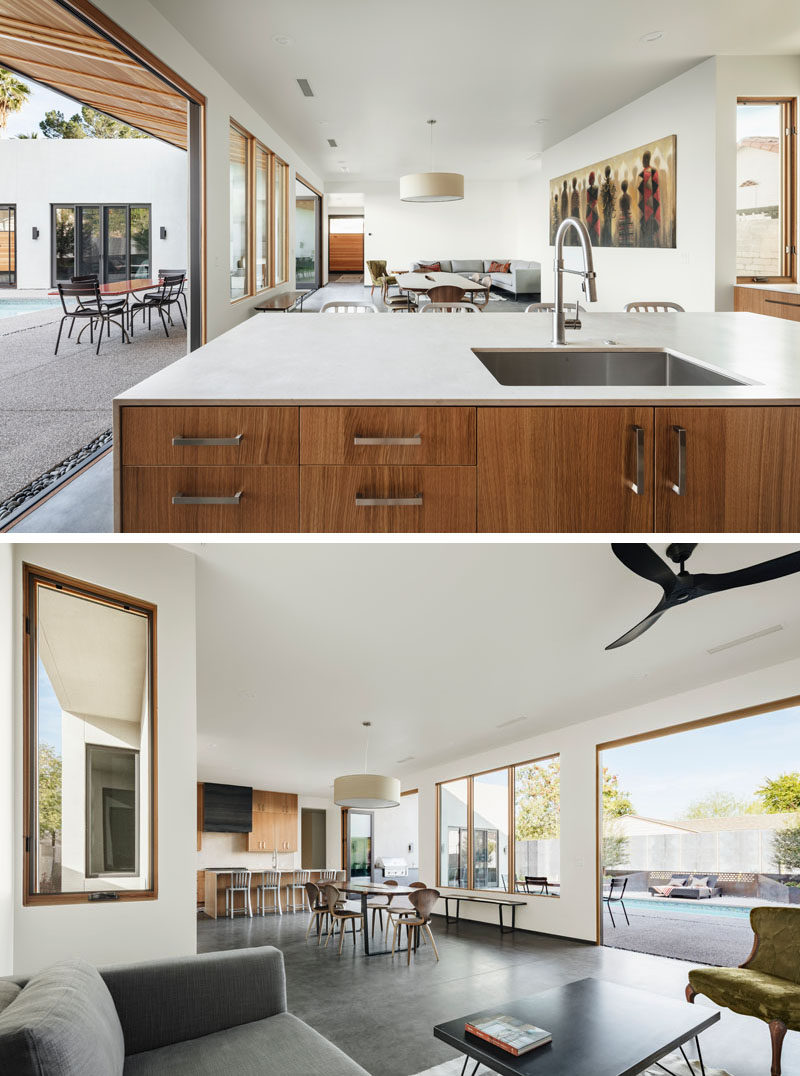 The main social areas of this modern house are all open plan, with the dining area separating the living room from the kitchen. #ModernInteriorDesign #OpenPlanInterior #InteriorDesign