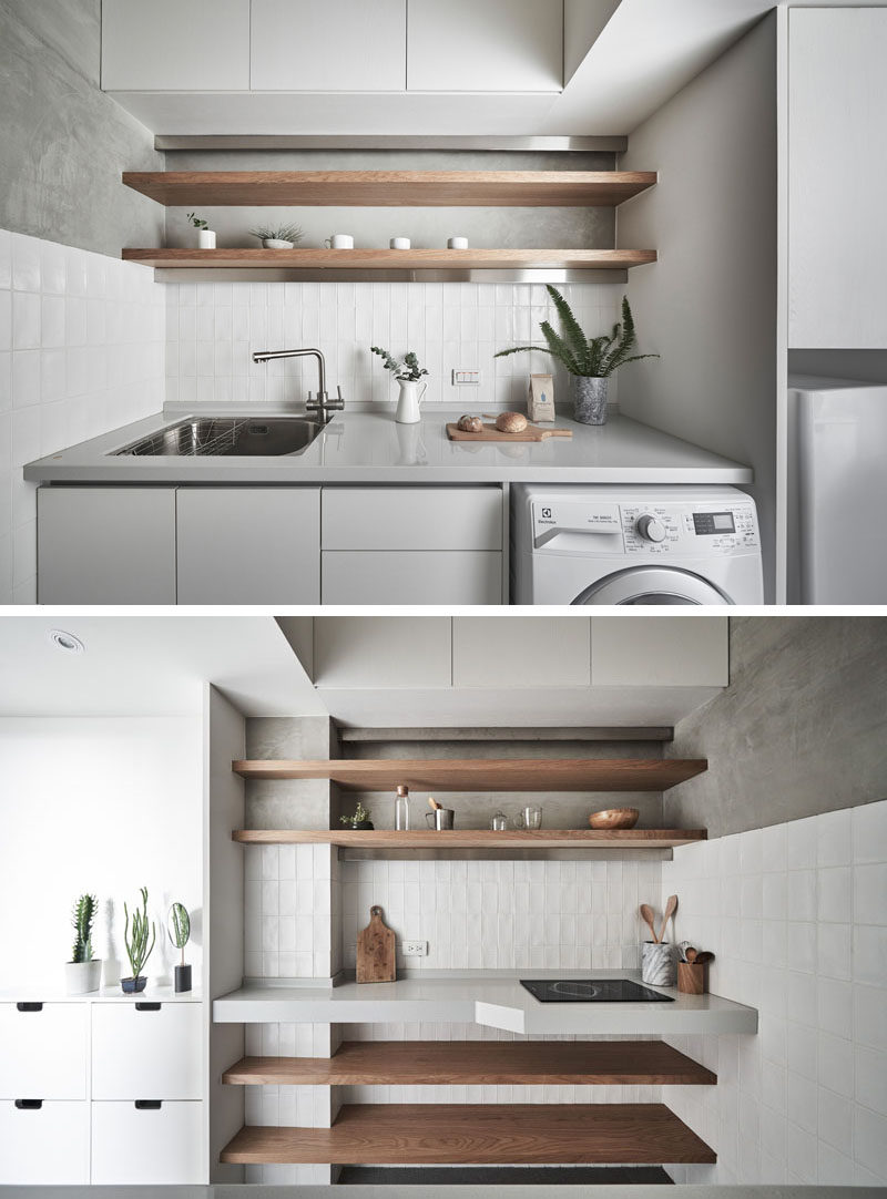 In this tiny and modern kitchen, there's a side with the fridge, sink, washer/dryer, and storage. On the opposite wall, there's a small electric stove and open wood shelving. #TinyKitchen #ModernKitchen #SmallKitchen