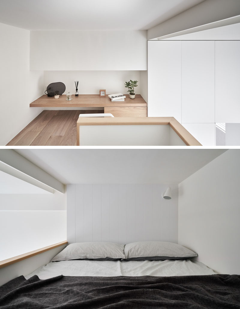 At the top of the stairs in this tiny apartment, is a little wood shelf with a drawer, while the opposite wall acts as a headboard for the lofted bed. #LoftBed #SmallApartment #TinyLiving