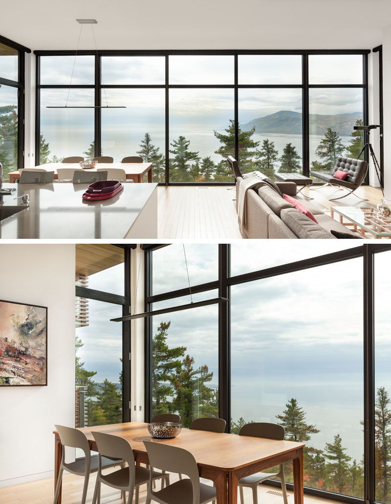 Inside this modern house, the living space’s glass wall provides a picturesque frame for the river, while the open floor plan allows for the natural light to flood the interior. #LivingRoom #DiningRoom #Windows