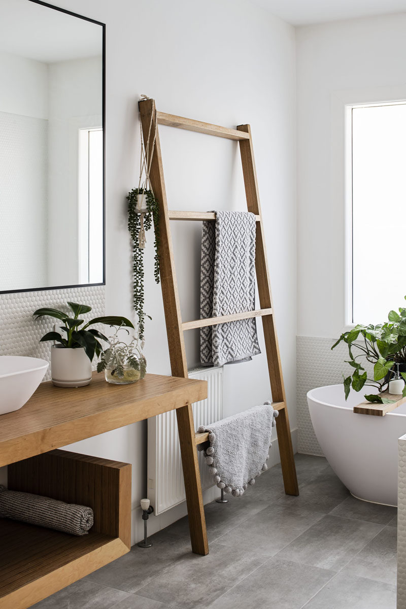 This updated and modern bathroom was kept simple with the use of a neutral color palette and natural materials. #ModernBathroom #BathroomDesign