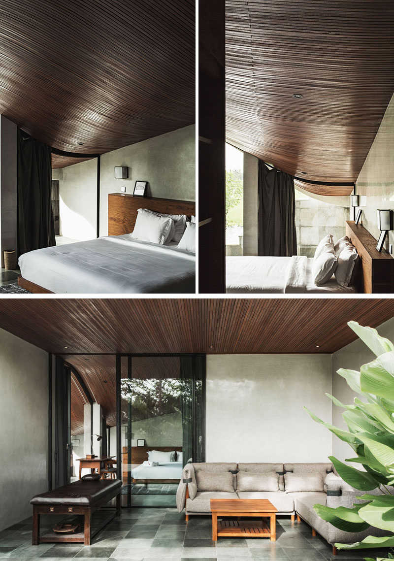 This modern bathroom showcases the curved wood ceiling, while a sliding glass door opens the bedroom up to a private patio area. #WoodCeiling #CurvedCeiling #Bedroom #Patio