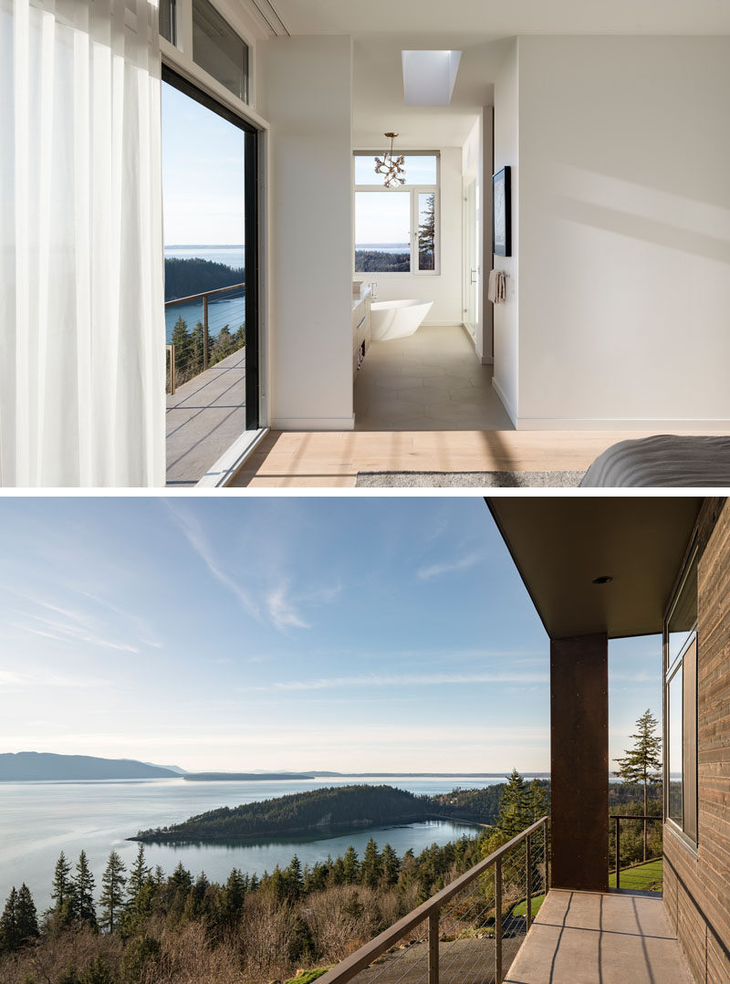 This modern master bedroom has a sliding door that opens up to a balcony, while the master bathroom has the freestanding bathtub positioned diagonally in the corner to take advantage of the views. #MasterBedroom #Balcony #MasterBathroom