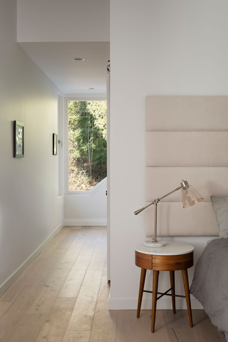  A tall window allows natural light to fill the hallway to the master bedroom and helps to create a calming atmosphere. #MasterBedroom #Window #Hallway