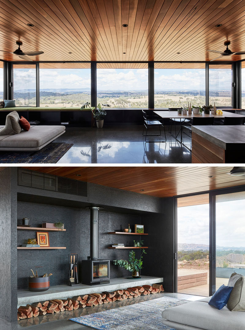 The large canopy overhangs and eaves are deep, allowing this modern house to be protected against the sun and winds. Inside the home, palette is dark and moody, with wood, dark materials, and concrete heavily featured. #FirewoodStorage #Windows #WoodCeiling #Fireplace