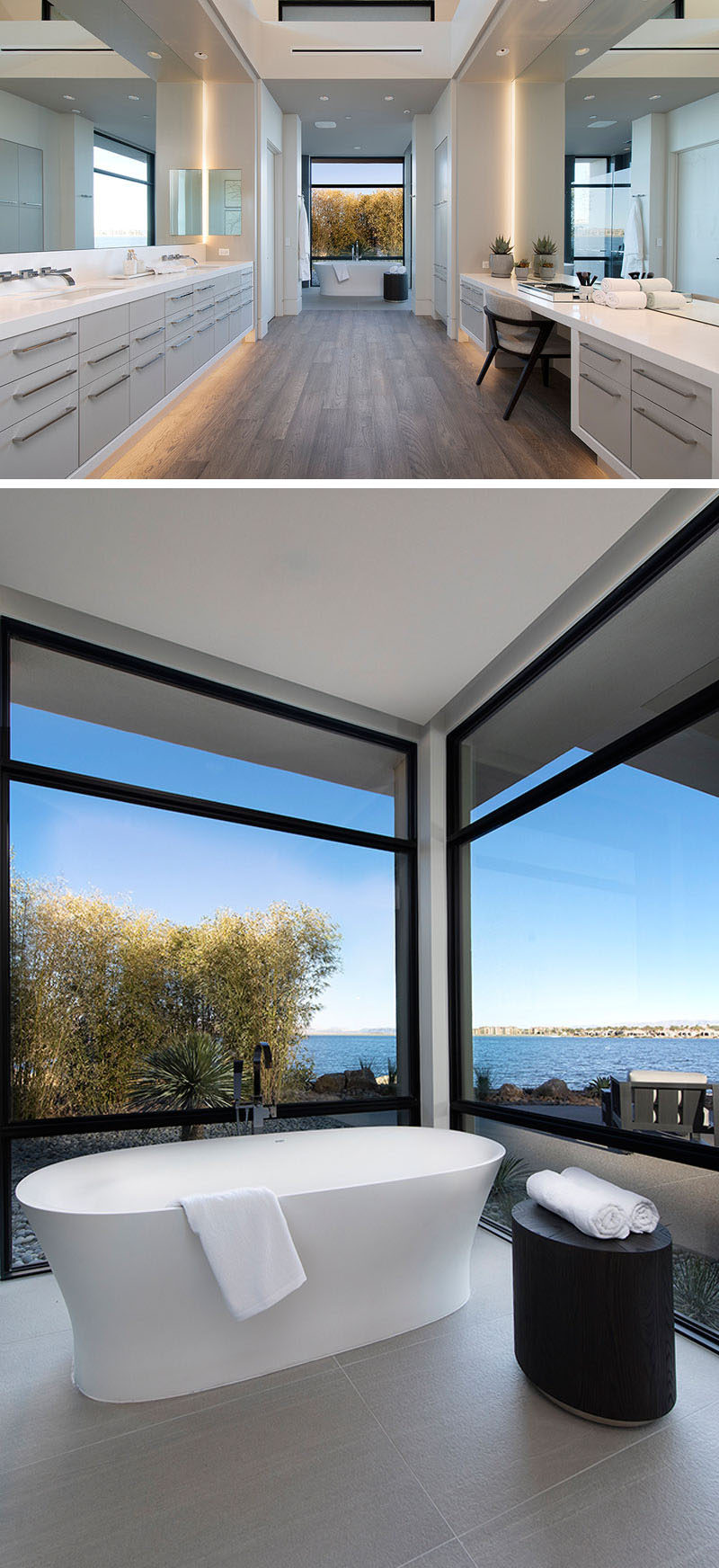 In this modern master bathroom, a large dual vanity sits opposite a secondary vanity, white at the end of the space is a freestanding bathtub, that's positioned in front of floor-to-ceiling windows with water views. #MasterBathroom #ModernBathroom #BathroomDesign