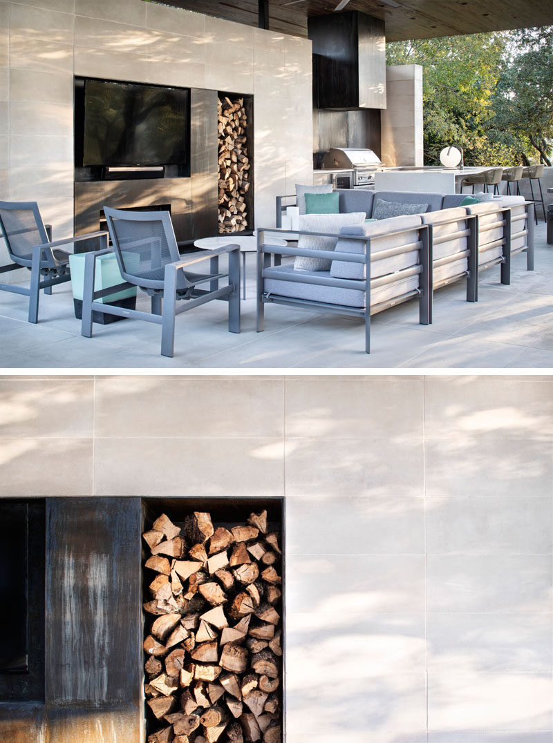 In this outdoor living room, oxidized steel panels have been used in the design of the fireplace, providing separation for the television and firewood storage. #Fireplace #OutdoorLivingRoom