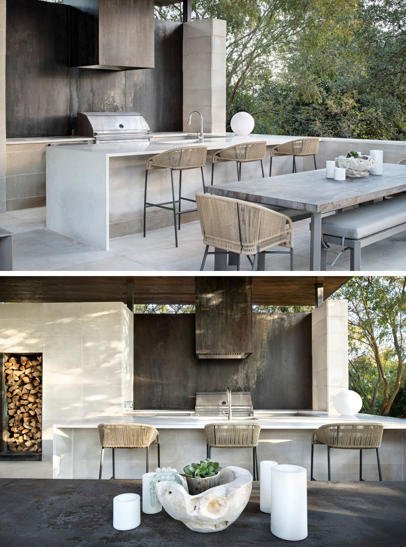 Oxidized steel panels have been used behind the grill in this modern outdoor kitchen. #OutdoorKitchen