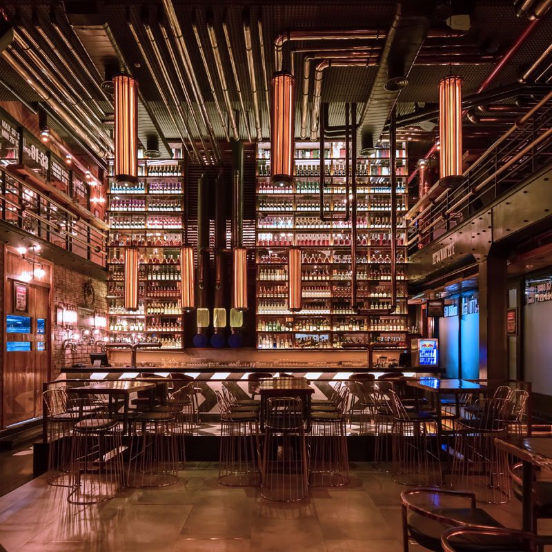 This restaurant has been inspired by a refinery, and to reflect this, the designers used stainless steel pipes finished with PVD coating of copper in glossy, matte and black finishes. #Restaurant #ModernRestaurant