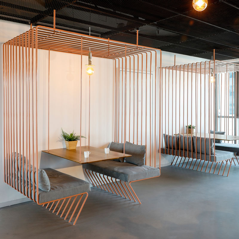 This Tel Aviv office design for a software company includes minimalist meeting spaces that appear like open cages within the space. #OfficeDesign #ModernOffice #OfficeSeating #Workplace