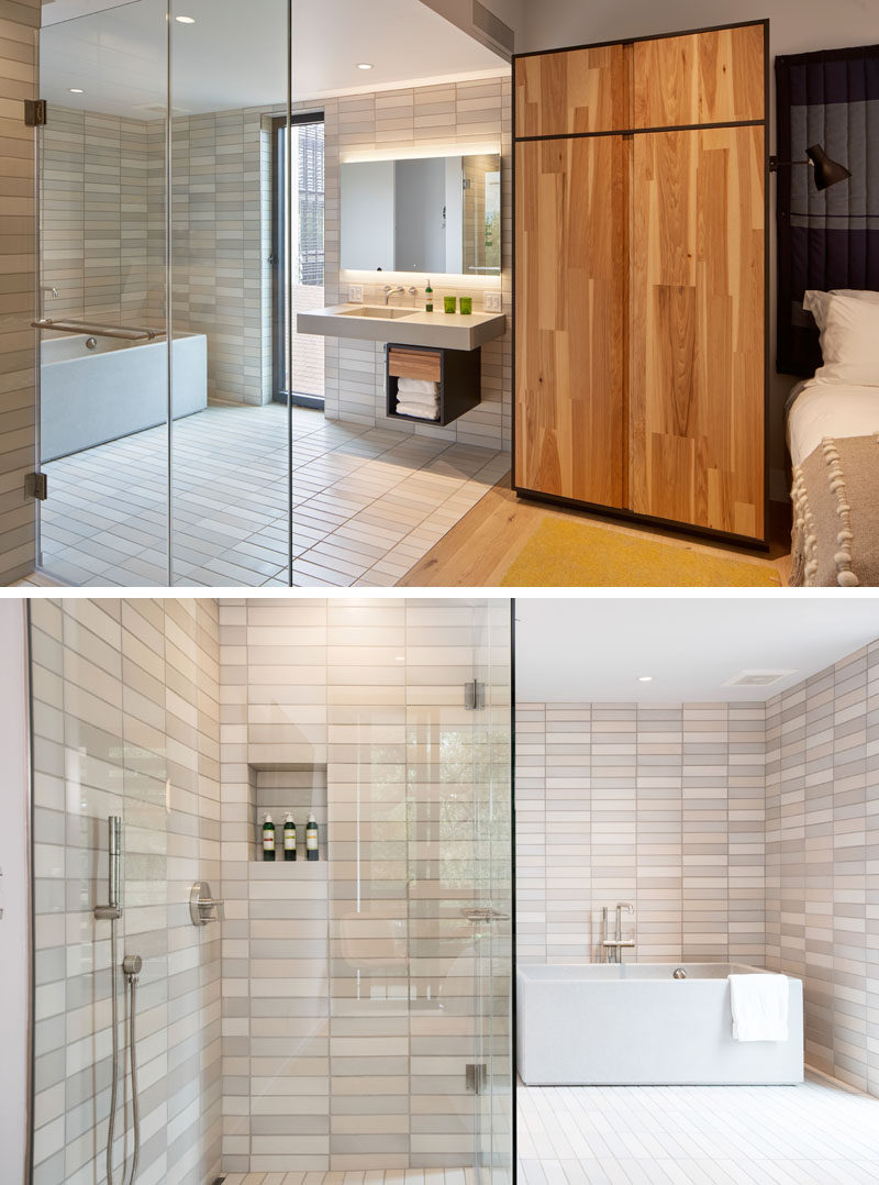 This modern hotel room has an open ensuite bathroom, with both a glass-enclosed walk-in shower, and a Sonoma Stoneworks cast tub and vanity. #ModernBathroom #BathroomDesign #HotelBathroom