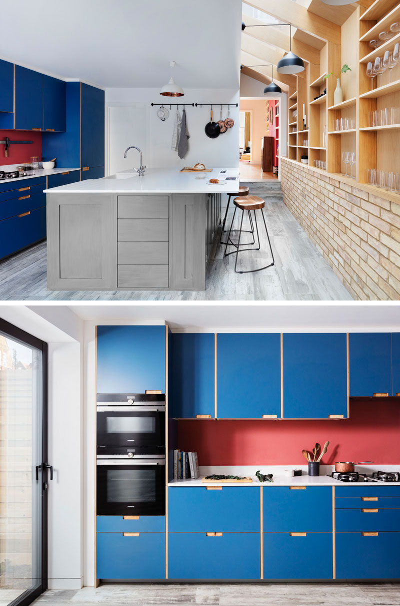 This renovated house features a modified IKEA kitchen finished with blue plywood fronts, and a bespoke kitchen island design with room for seating. A new guest bathroom was added behind the kitchen. #BlueKitchen #KitchenDesign #ModernKitchen