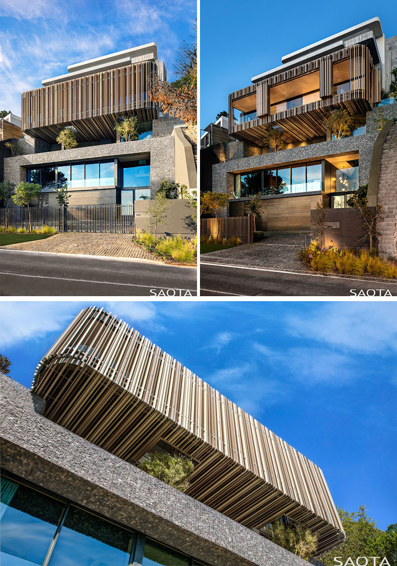 The facade of this modern house showcases a gabion-walled exterior and a vertically slatted box that hovers over a terrace. #Gabion #ModernArchitecture #ModernHouse