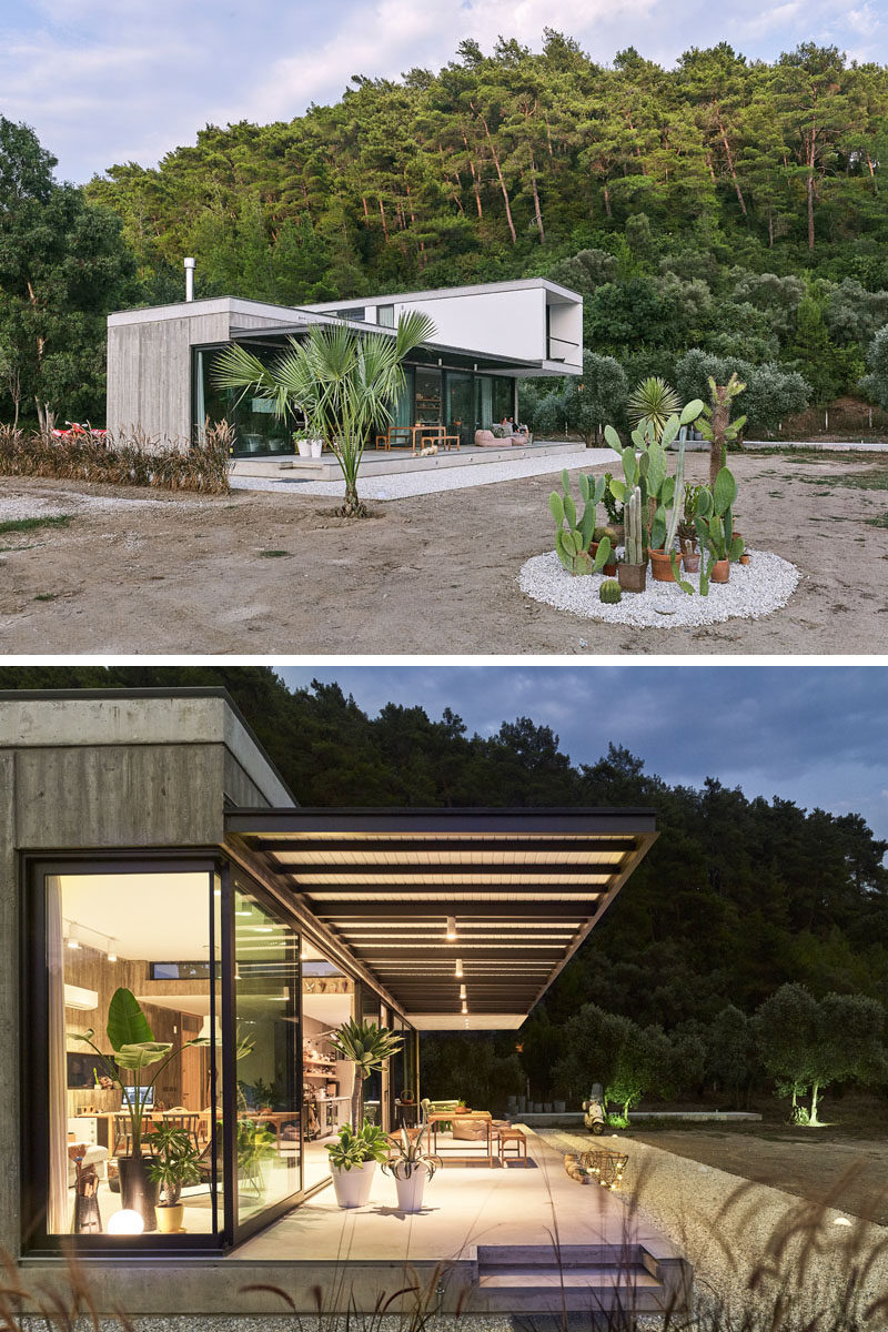 At the rear of this modern house, a large deck looks out onto the landscape, and provides a indoor / outdoor living environment for the home owners. #ModernHouse #OutdoorSpace #ModernArchitecture