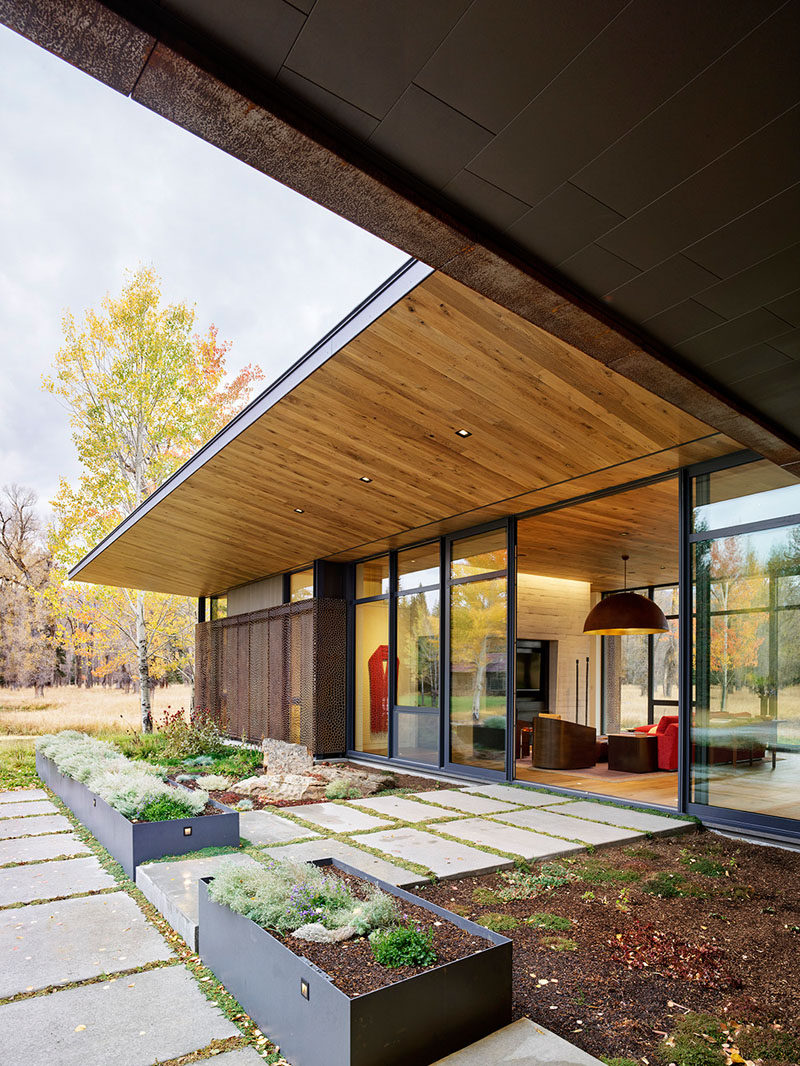 This modernist flat-roofed glass pavilion was conceived as a retreat for the owners, who wanted a nature-oriented outlook, allowing them to enjoy their surroundings, that includes two spring creeks. #Guesthouse #Architecture #Landscaping