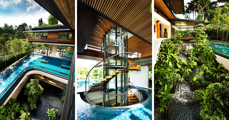 This modern house in Singapore features a curved swimming pool, a sculptural staircase, and a waterfall. #ModernHouse #HouseDesign #ModernArchitecture