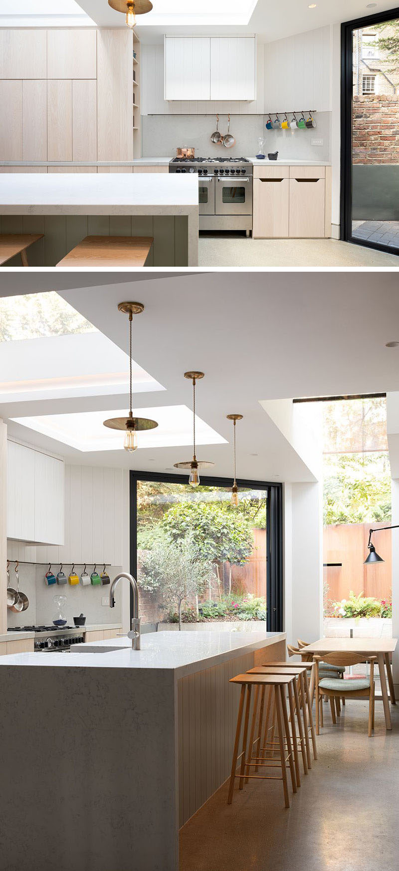 This modern kitchen features light wood, hardware-free cabinetry, while the island has complementing marble countertops. #ModernKitchen #KitchenDesign