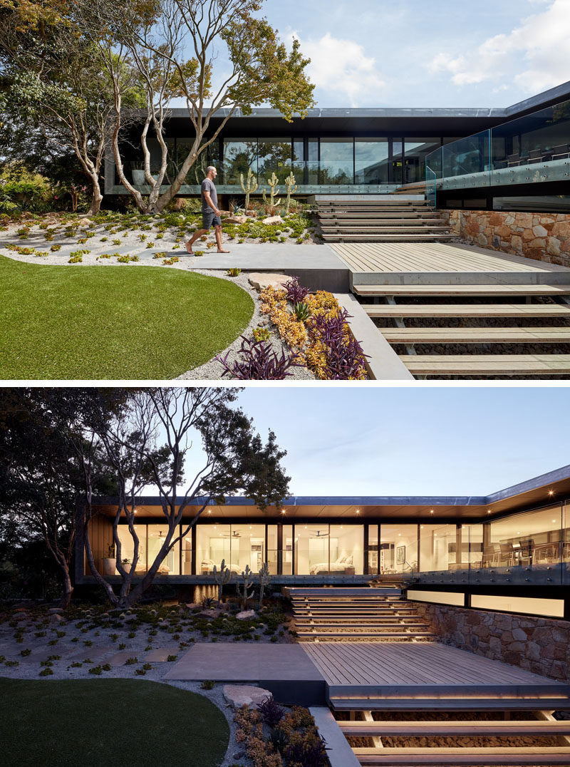 This modern house opens up to a multi-level landscaped garden with stairs that lead down to the swimming pool. At night the stairs appear to glow from the hidden lighting. #ModernLandscaping #OutdoorStairs