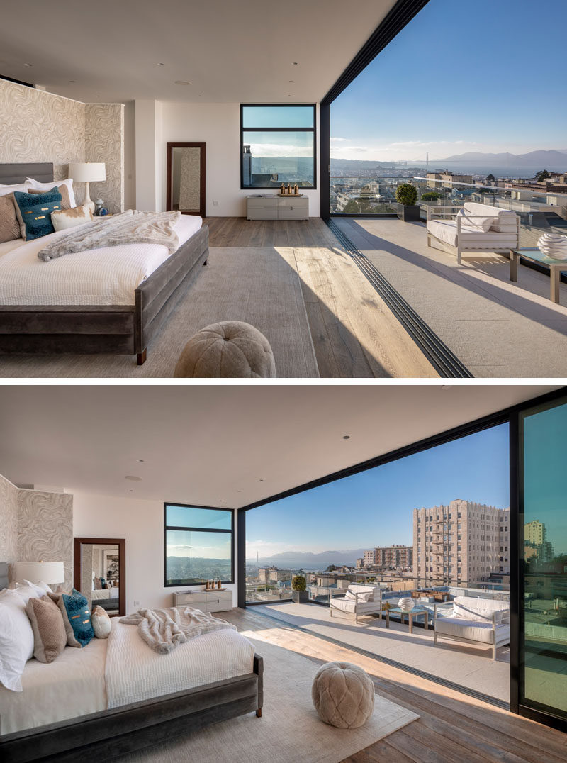 The entire fourth floor of this modern house is dedicated to a master bedroom suite, that has a large sliding glass wall that opens to a private balcony. #MasterBedroom #MasterSuite #ModernBedroom #Balcony