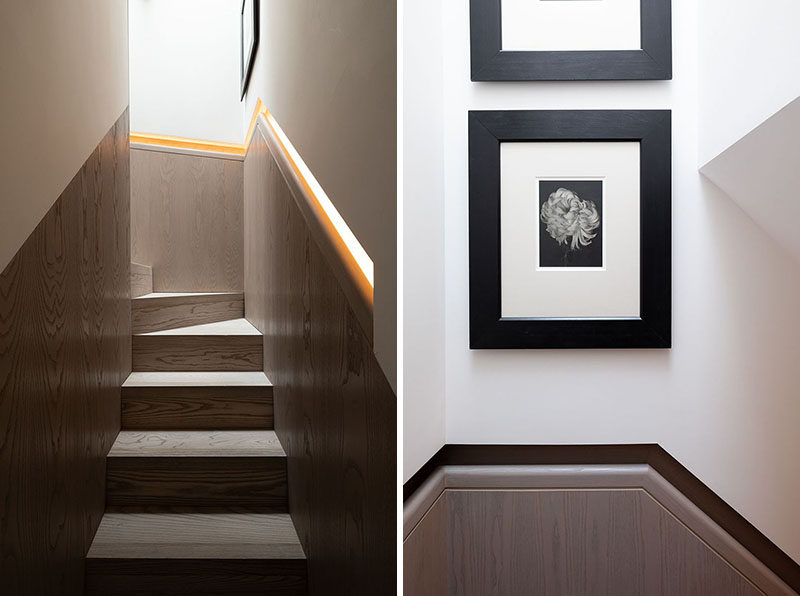 This modern wood staircase has a built-in handrail that features hidden lighting. #Stairs #BuiltInHandrail