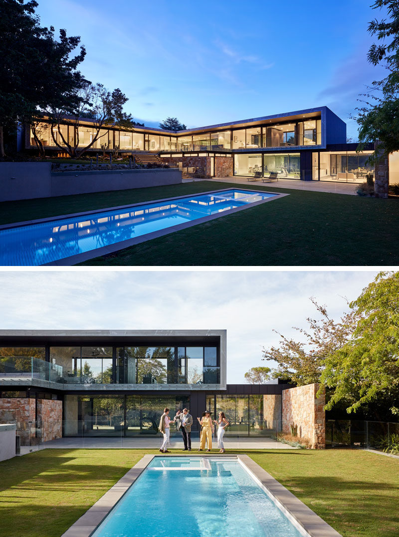 This modern house has a long swimming pool is surrounded by a manicured lawn, providing plenty of space to relax in the sunshine or entertain. #SwimmingPool #ModernArchitecture