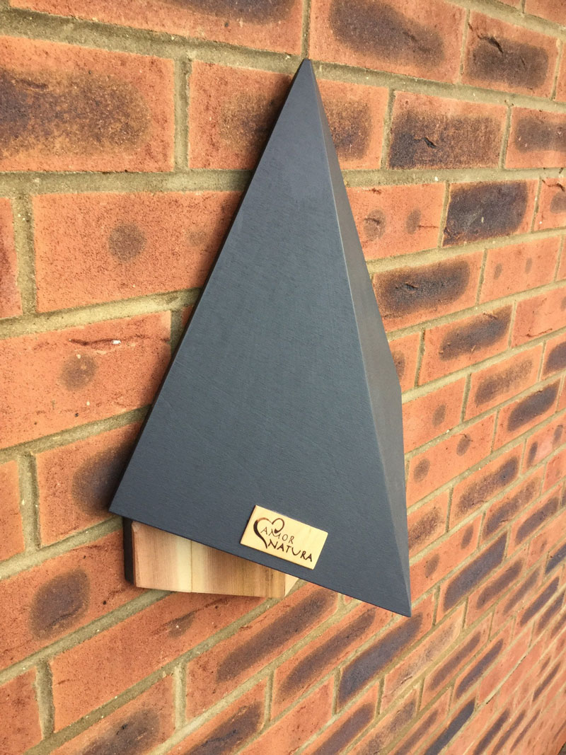 The 'Stealth' Bat House by AmorNatura, has a simple dark grey exterior, and a shape that that helps to deflect high winds. #BatHouse #BatBox