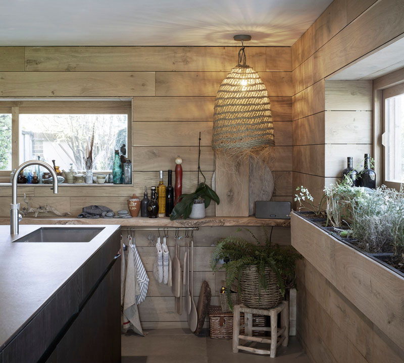 This kitchen is decorated with reclaimed materials, referencing the worn and weary effect of time spent on the beach or at the sea side. #KitchenDesign #ReclaimedMaterials