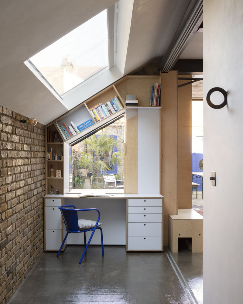 Flexibility of spaces and storage solutions were key elements when designing the interior of this home, and as such, design elements, like this small office nook with angled shelving, have been included. #OfficeNook #Desk #HomeOffice