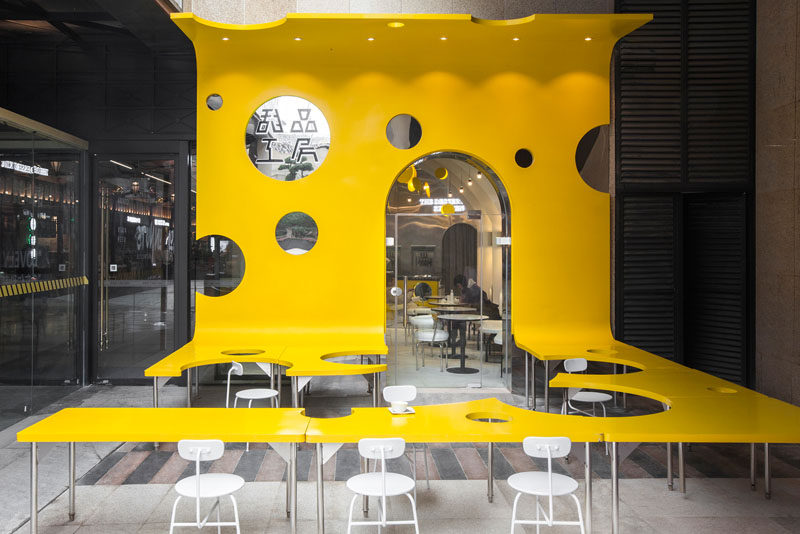 Towodesign has recently completed a new cafe named 'The Dessert KITCHEN', that's located in an underground mall in Chengdu, China, and has an eye-catching facade and an outdoor dining area that's designed like a slice of cheese. #Facade #CafeDesign #RetailDesign