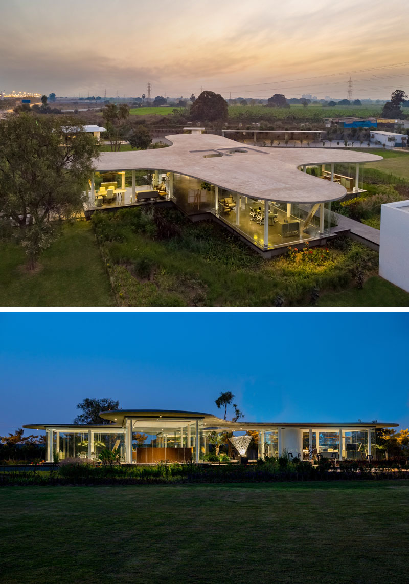 Hiren Patel Architects have recently completed Amoeba, a modern office for their firm, that includes two directors offices, a meeting room, and an administration area. #ModernOffice #ModernArchitecture #GlassWalls #CantileveredRoof