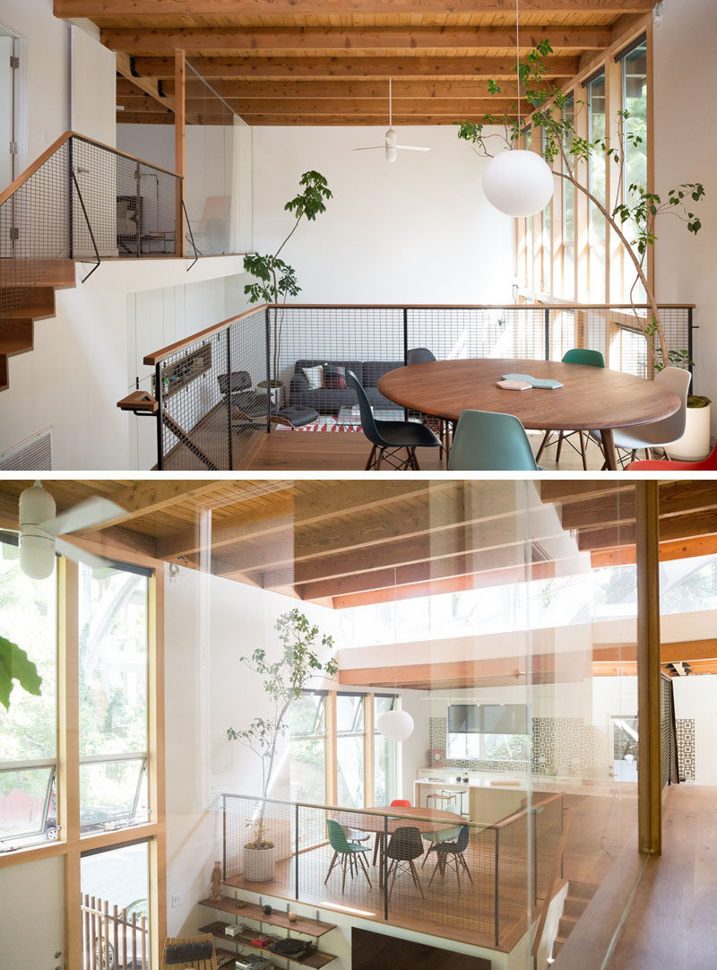 The original split level layout of this renovated mid century modern house follows the natural grade of the site, and in the kitchen, a solid wall was replaced with a clerestory window. It frames the bridge in a really interesting way that can be seen from almost every space in the house. #SplitLevel #MidCenturyModern #InteriorDesign