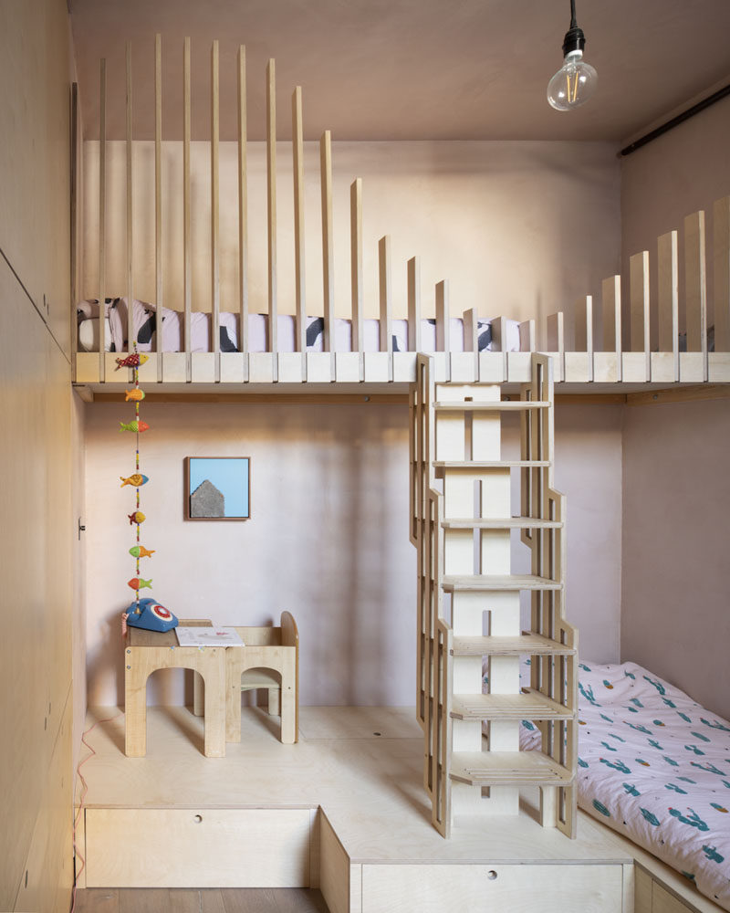 In order to allow two children to sleep in this bedroom, a bunk bed has been designed with wood fins as a safety feature. A play area has also been included and is raised to accommodate additional storage underneath. #KidsBedroom #BunkBeds #InteriorDesign #BedroomDesign