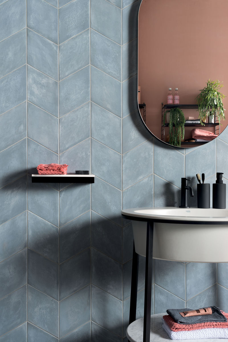 Tiles come in every hue and tone found under the sun, but muted colors have recently taken the tile industry by storm. While vivid colors have their place, the subdued chroma of pale blue allows for designers to apply entire fields of color to a space. #MutedTiles #TileDesign #ModernTiles