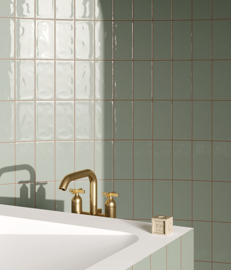 Tiles come in every hue and tone found under the sun, but muted colors have recently taken the tile industry by storm. While vivid colors have their place, the subdued chroma of sage green allows for designers to apply entire fields of color to a space. #MutedTiles #TileDesign #ModernTiles