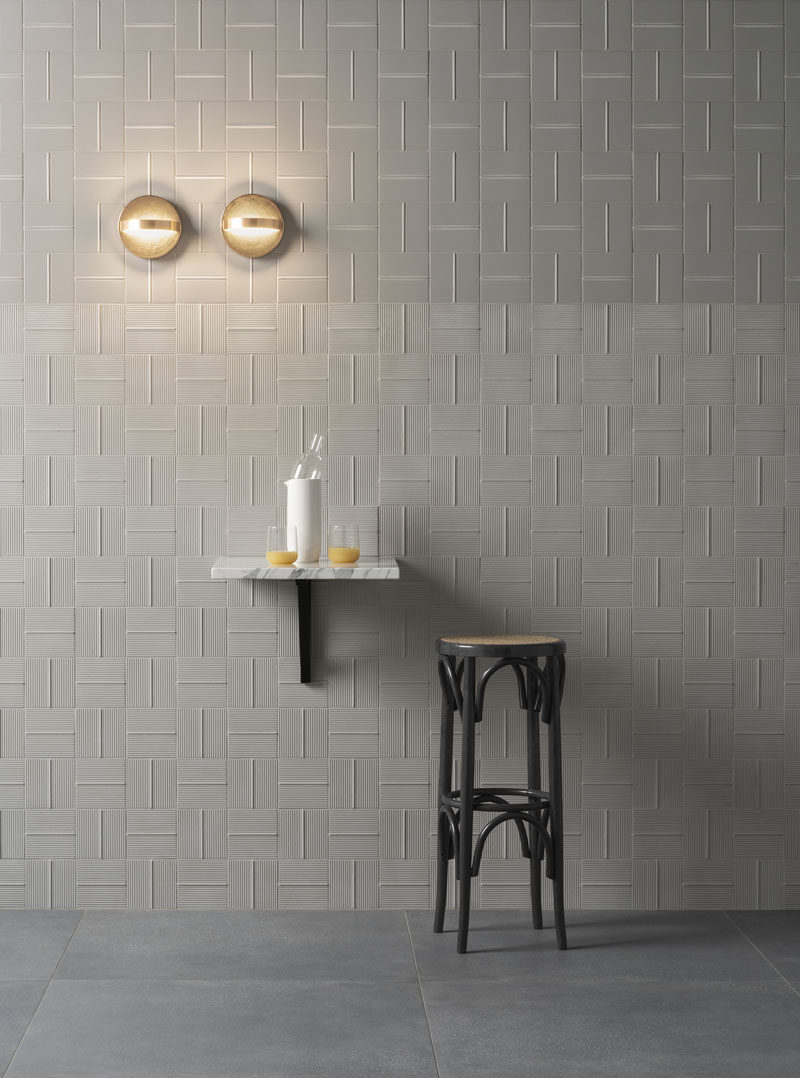 These modern tiles with lines help to create movement, add height, and generate visual interest, in any room. #ModernTiles #TileDesign #ContemporaryTiles