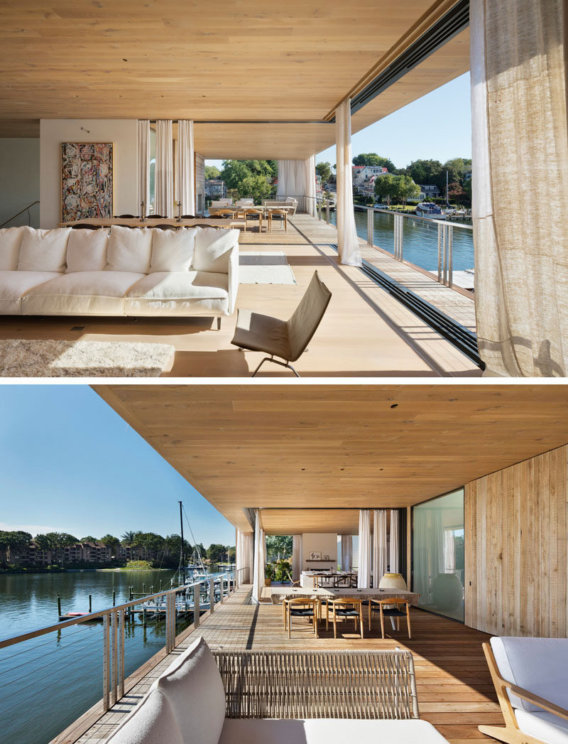 The living areas of this modern house are located upstairs, with pocketing sliding glass doors and balconies proving uninterrupted views of the harbor. #ModernHouse #ModernInterior